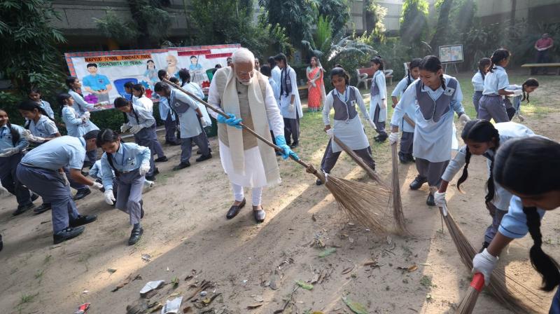 PM Modi took part cleanliness campaign Delhi school Gandhi Jayanti news