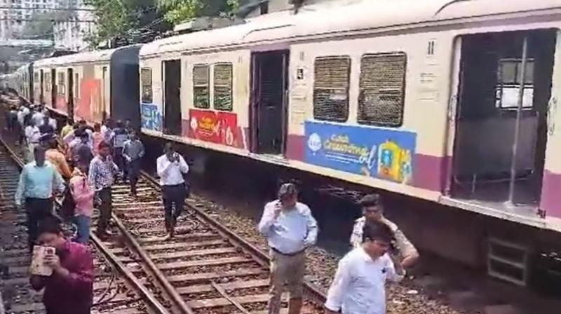 Mumbai local train service partially affected, passengers angry