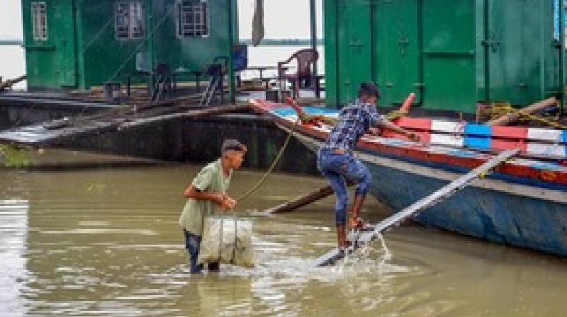 Flood situation in Assam still grim( फोटो साभार- PTI) 