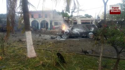 A blast outside a police station in Mexico kills two officers and injures seven.