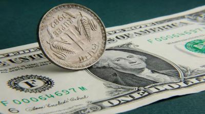 Rupee gains 8 paise at 82.76 per dollar