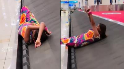 Girl making video while lying on conveyor belt goes VIRAL news in hindi